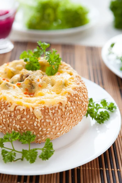 Bun baked with cheese and mushrooms Royalty Free Stock Images