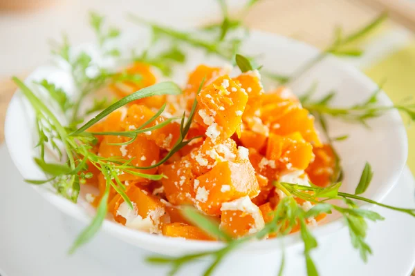 Roasted pumpkin with cream in a white bowl — Stock Photo, Image