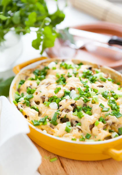 Mushroom gratin with parmesan cheese in a pot for baking — Stock Photo, Image