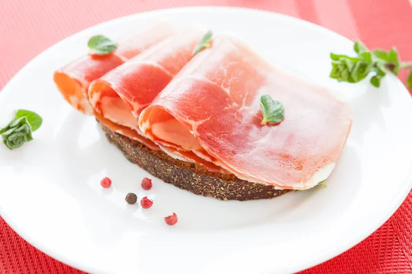Mouthwatering ham on whole grain bread — Stok Foto