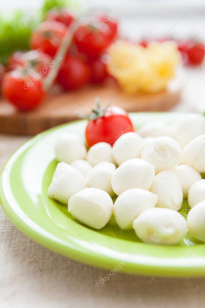 balls of mozzarella cheese and cherry tomatoes