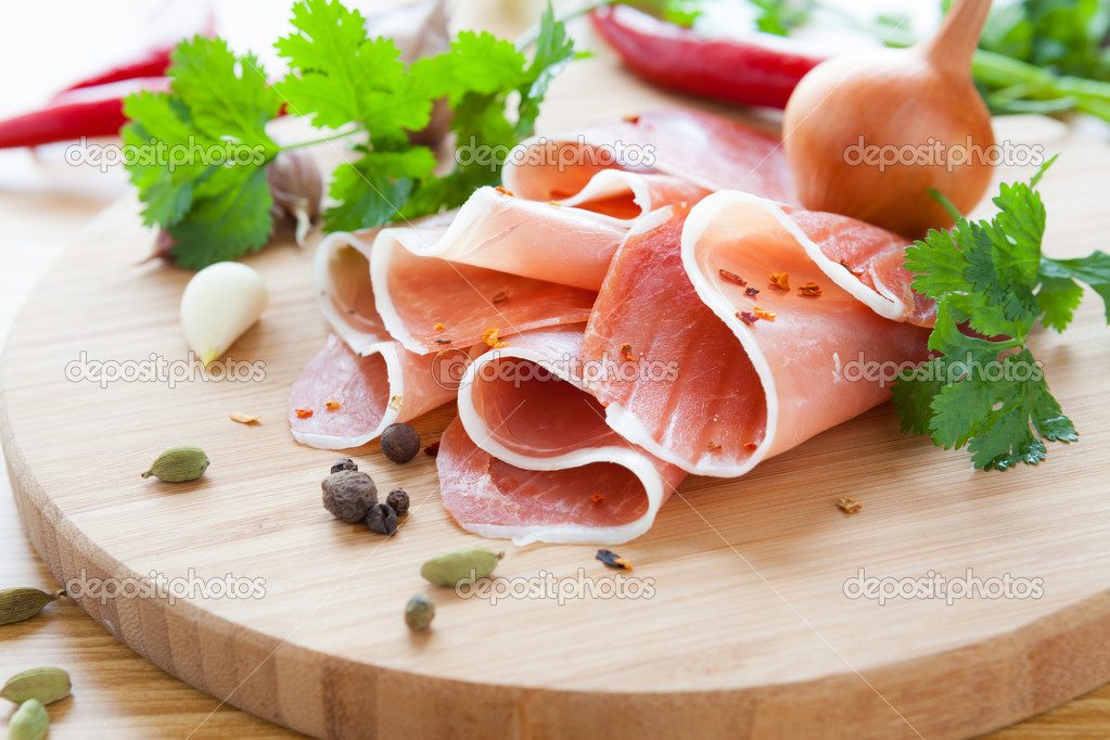 thin slices of ham with herbs and spices