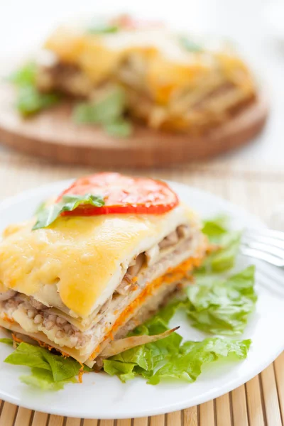 Vegetable lasagna on lettuce leaf — Stock Photo, Image