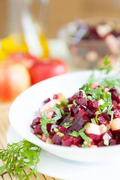 Nutritious salad with beets in a white bowl — Stock Photo, Image