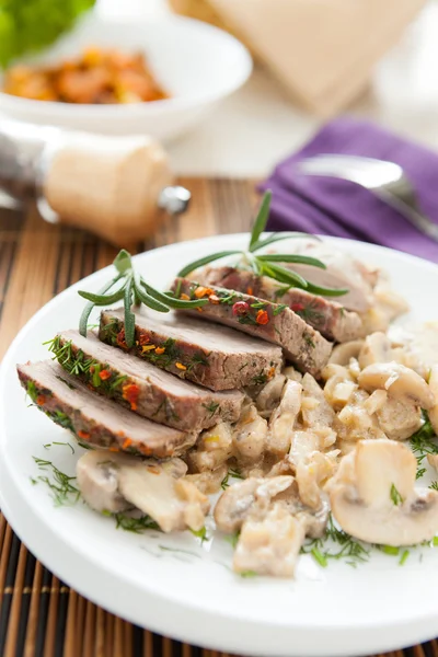 Pork cooked with mushrooms and sour cream — Stock Photo, Image