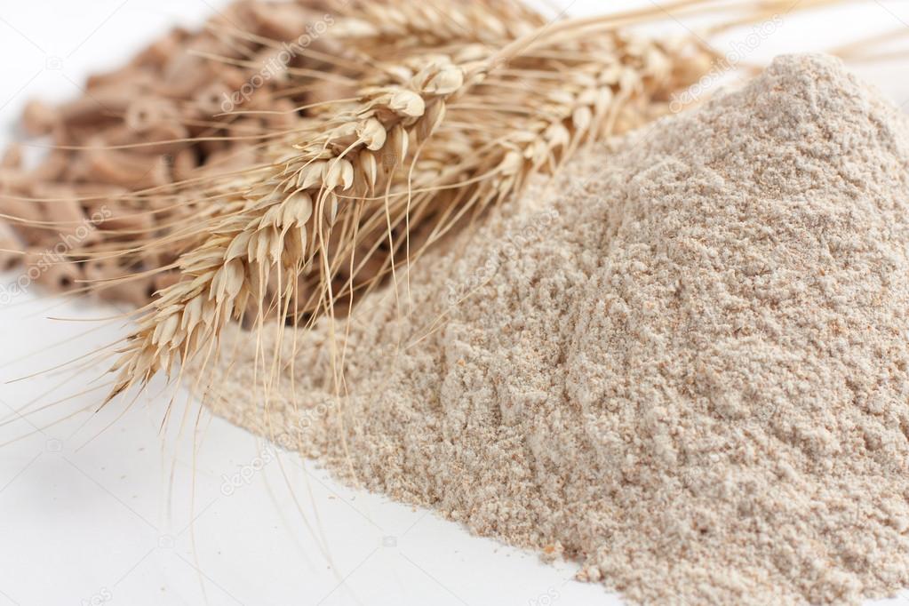 Wholemeal wheat flour and ears of wheat