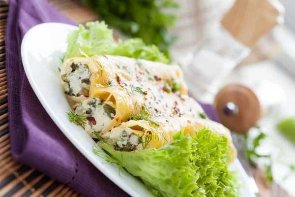 Cannelloni with goat cheese and chopped greens — Stock Photo, Image