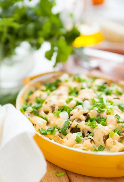 Mushroom gratin with parmesan in a pot for baking — Stock Photo, Image