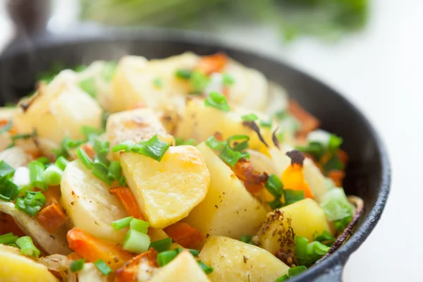 Golden pieces of fried potatoes — Stock Photo, Image