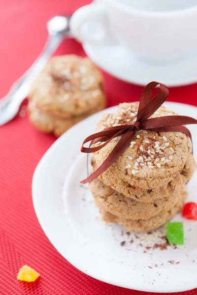 Stack of cereal cookies and a cup of tea — Stock Photo, Image