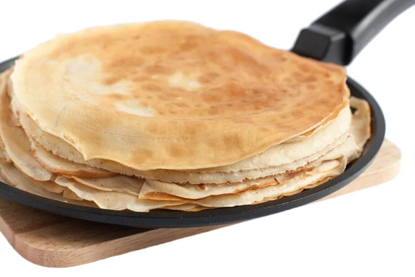 Thin dairy pancakes in a frying pan — Stock Photo, Image