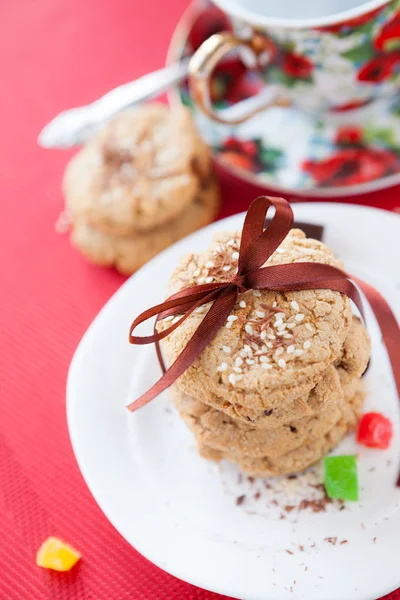 Stack of oat biscuits and a cup of tea — Stock Photo, Image