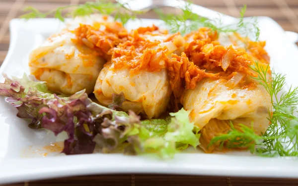 Stuffed cabbage with carrot sauce — Stock Photo, Image