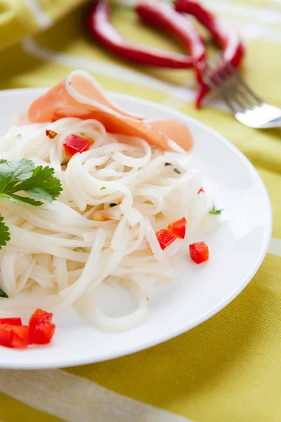 Rice noodles with cilantro on a white plate — Stock Photo, Image