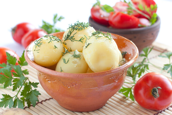 Boiled potatoes and tomato salad