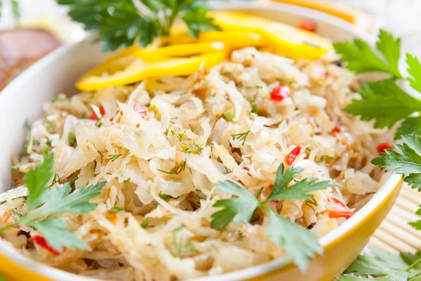 Freshly stewed cabbage in a yellow pot — Stock Photo, Image