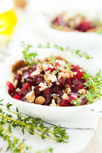Slices of beet with crushed nuts, salad — Stock Photo, Image