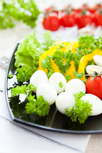 Fresh vegetables and boiled quail eggs — Stock Photo, Image
