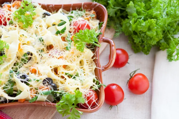 Pasta baked with grated cheese — Stock Photo, Image