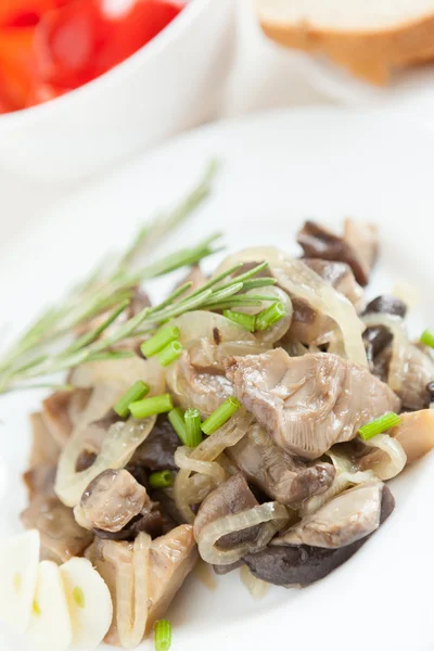 Roasted oyster mushrooms on a white plate — Stock Photo, Image