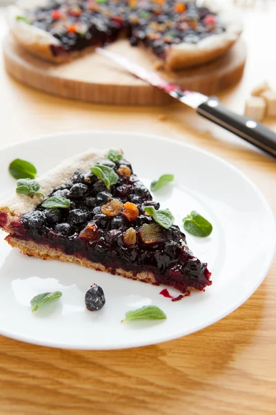 Piece of homemade cake with berries on a dish — Stock Photo, Image