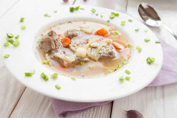 Large plate of nutritious soup with vermicelli — Stock Photo, Image