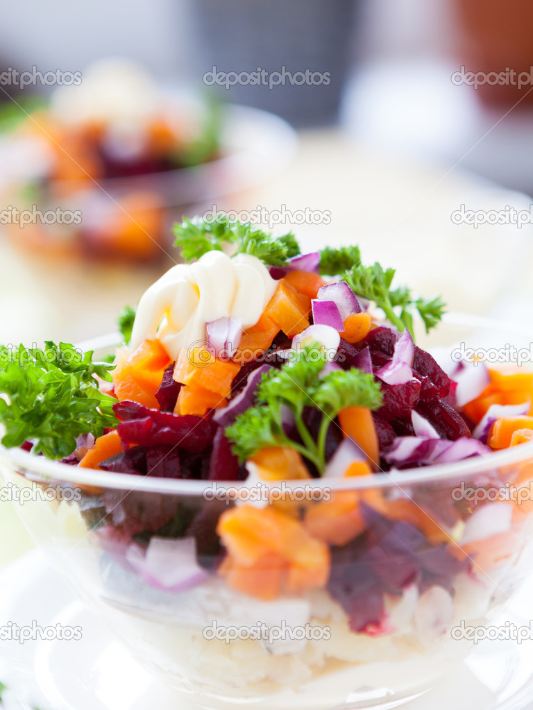 Appetizing salad in a transparent salad bowl