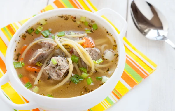 Meat soup with pasta in a tureen — Stock Photo, Image