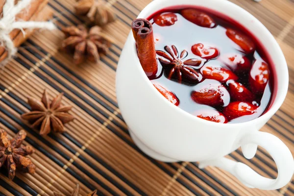 Mulled wine in a white cup and star anise — Stock Photo, Image