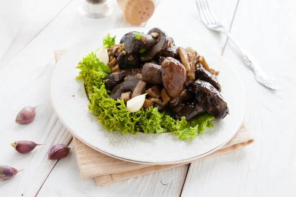 Fried wild mushrooms on white plate — Stock Photo, Image