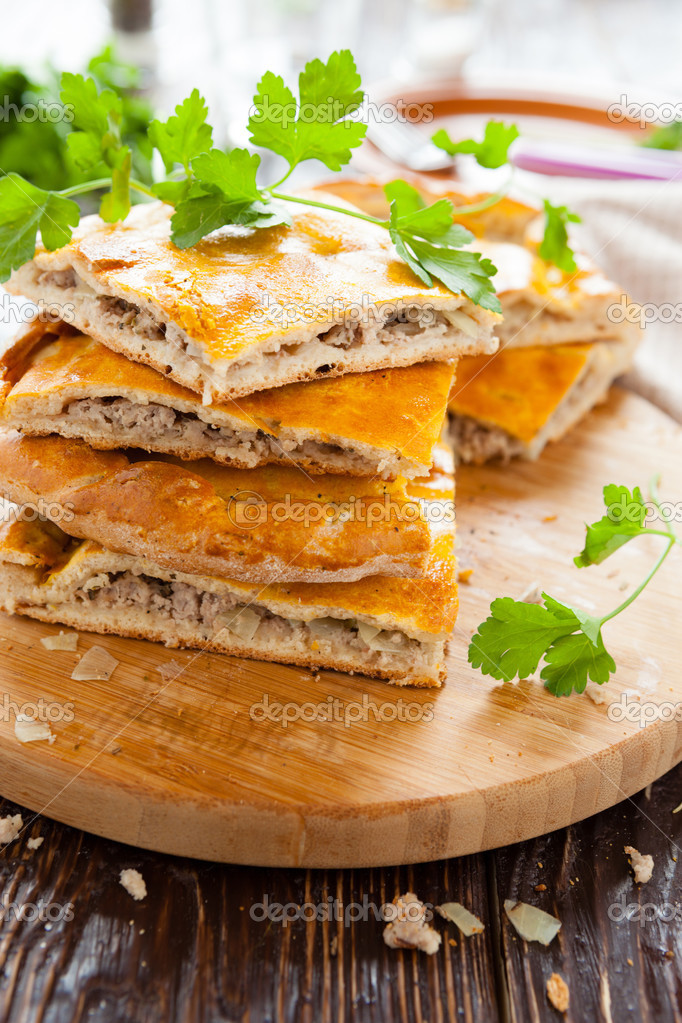 delicious meat pie slices and parsley