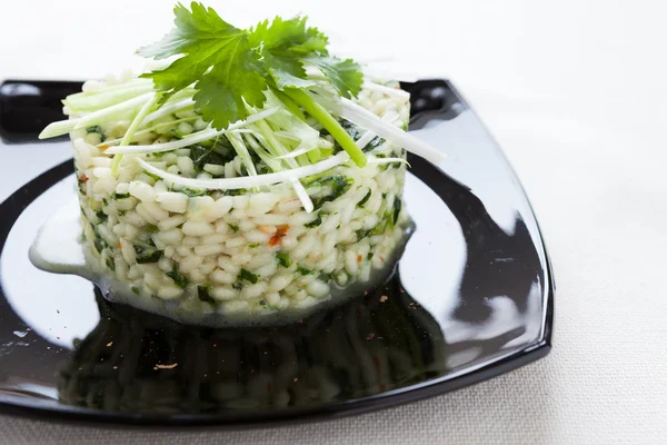 Risotto with spinach on a platter — Stock Photo, Image