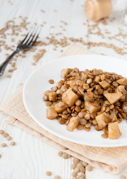 Lentil stew with celery on a white plate — Stock Photo, Image