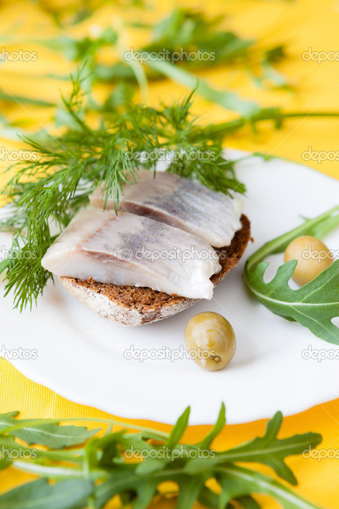 two slices of salty herring on rye bread