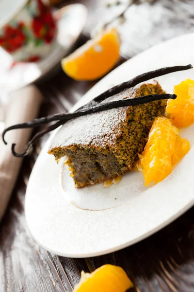 Piece of poppy seed cake with orange zest — Stock Photo, Image