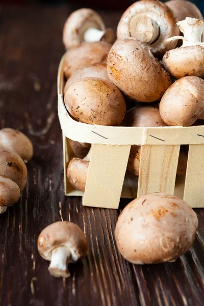 Fresh champignons in a basket — Stock Photo, Image