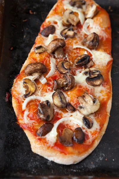 Unusual pizza with mushrooms and tomato sauce — Stock Photo, Image