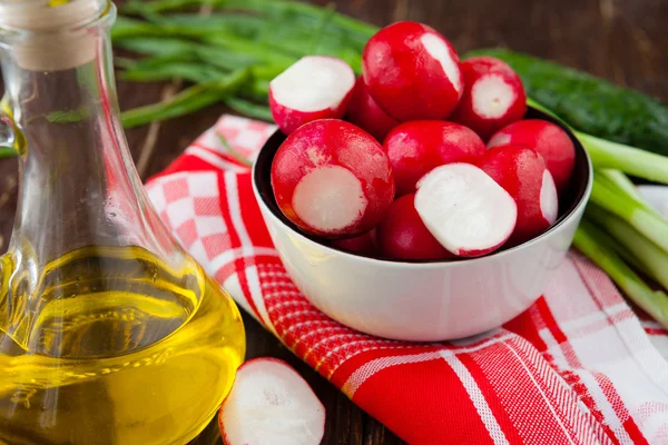 Juicy ripe radish in a bowl and other ingredients — Stock Photo, Image