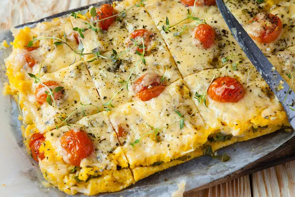 Tasty polenta with cheese on the board — Stock Photo, Image