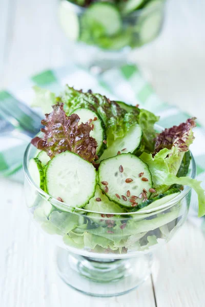 Cucumber salad in a transparent bowl — Stock Photo, Image