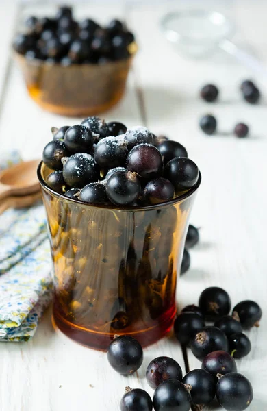 Black currant in a transparent glass — Stock Photo, Image