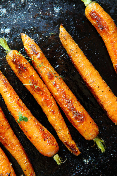 roasted baby carrots on a baking sheet