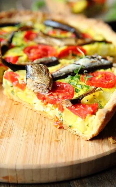 Piece of vegetable quiche with fish — Stock Photo, Image