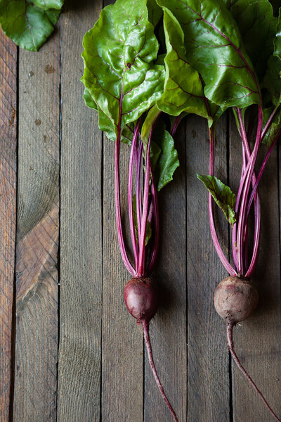beets with leaves on the boards