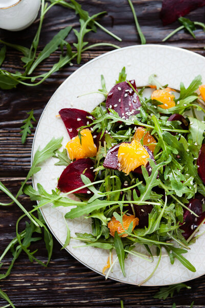 fresh salad with arugula, orange and beetroot