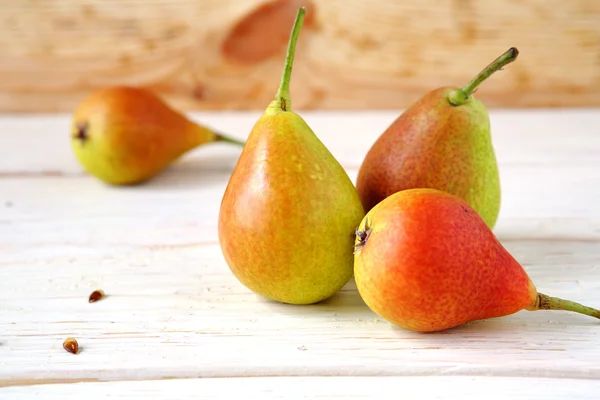 Fresh and juicy fruit on white boards — Stock Photo, Image