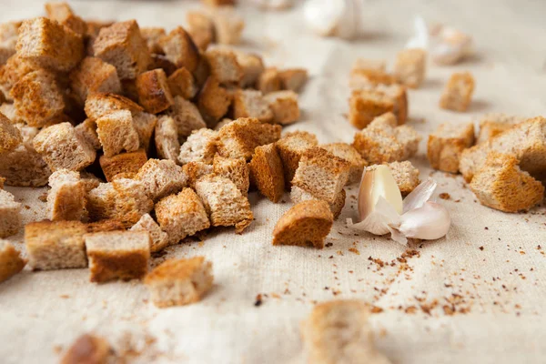 Rye bread croutons on fabric — Stock Photo, Image