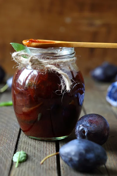 Plum jam in a glass jar — Stock Photo, Image