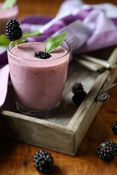 Berry smoothie in a glass on a tray — Stock Photo, Image