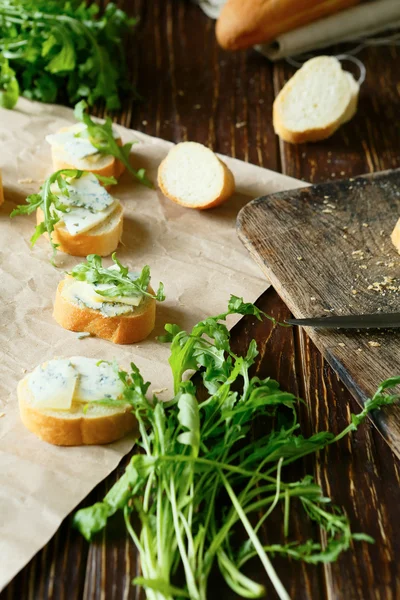 Baguette with cheese and herbs — Stock Photo, Image